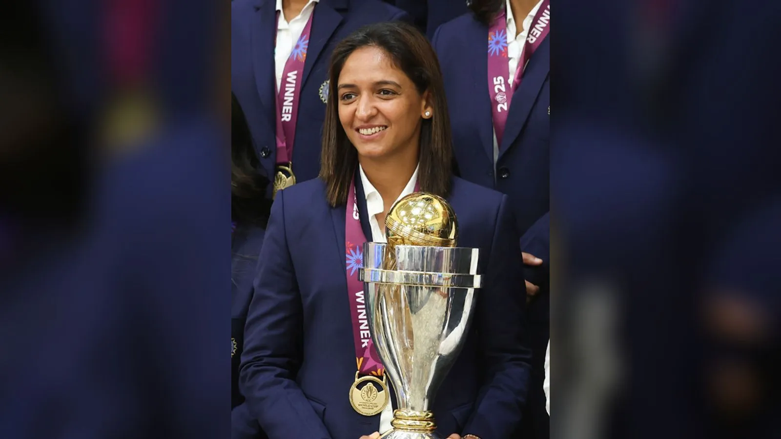 Harmanpreet Kaur holding the Women's Cricket World Cup trophy