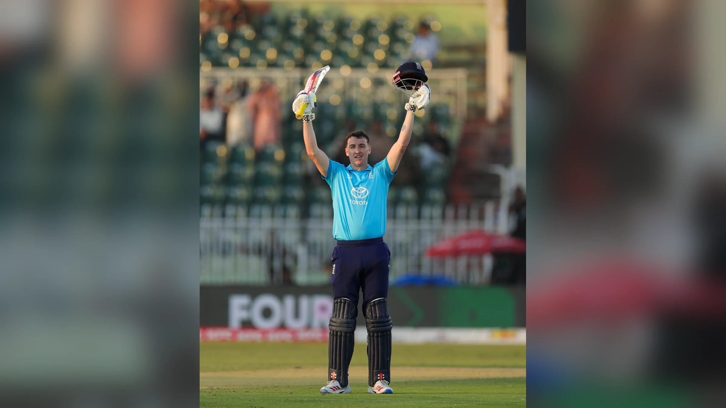 England captain Harry Brook raises his bat and helmet after reaching his double century in Rawalpindi