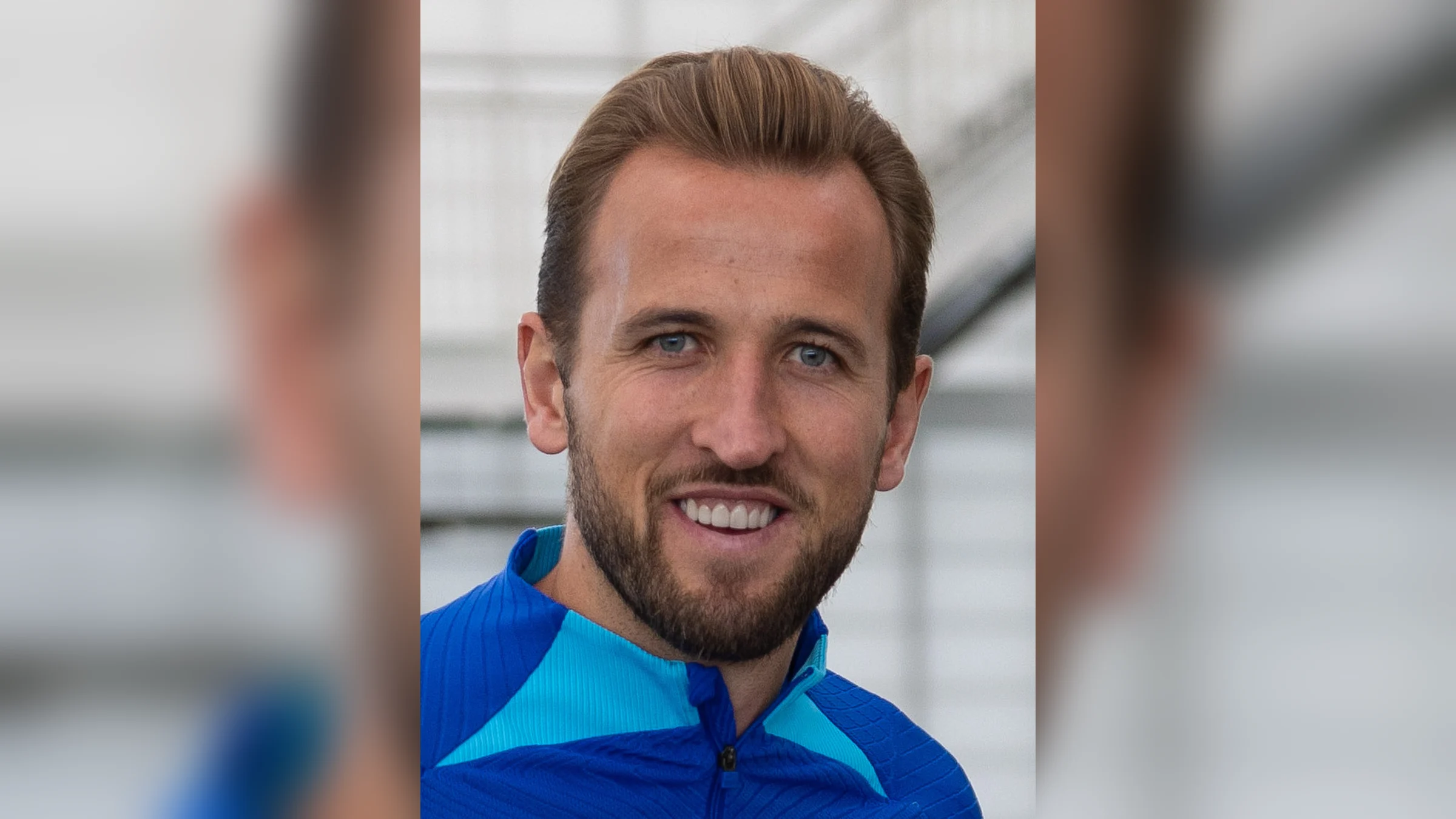England captain Harry Kane smiling in an England training top