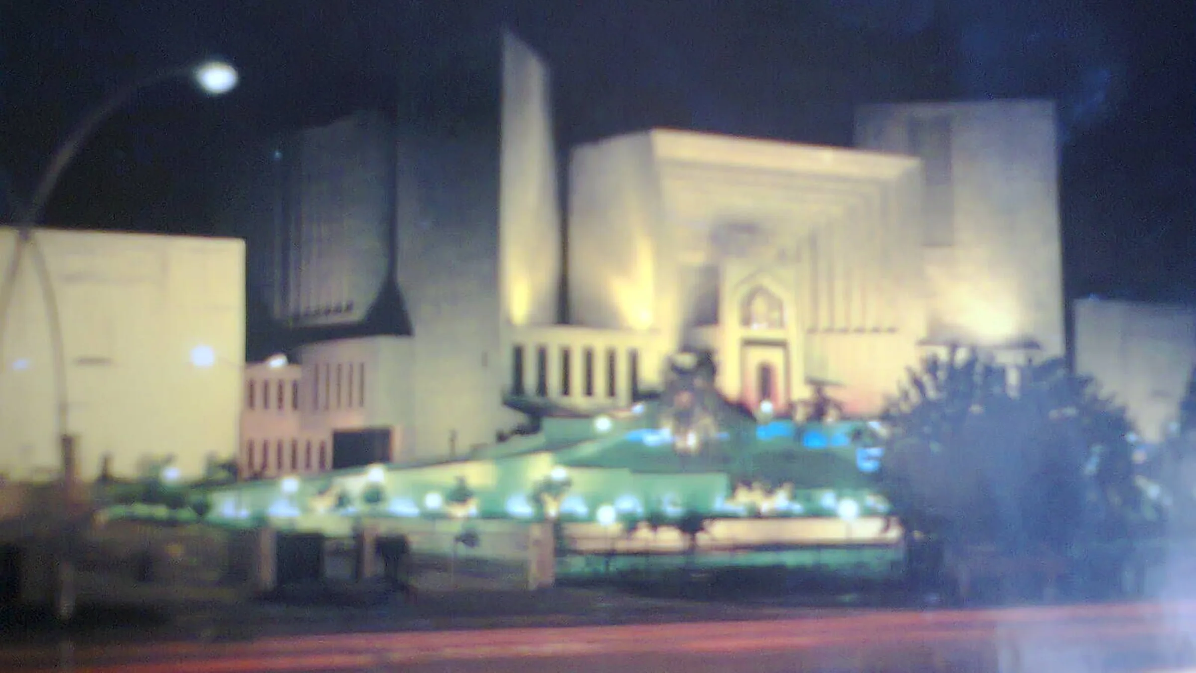 The Supreme Court of Pakistan building in Islamabad lit up at night