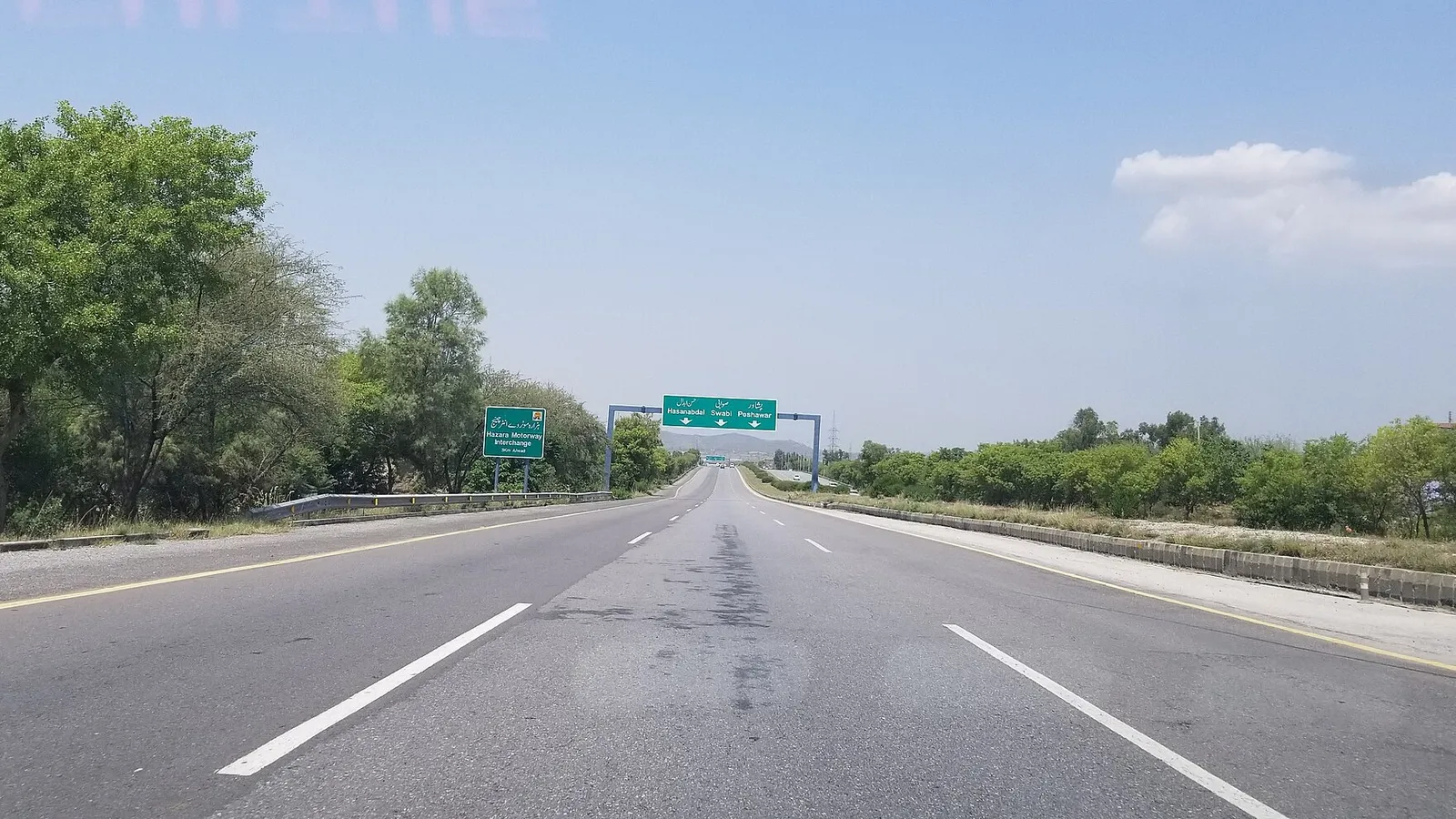 The M-1 Islamabad-Peshawar motorway stretching ahead under a clear sky