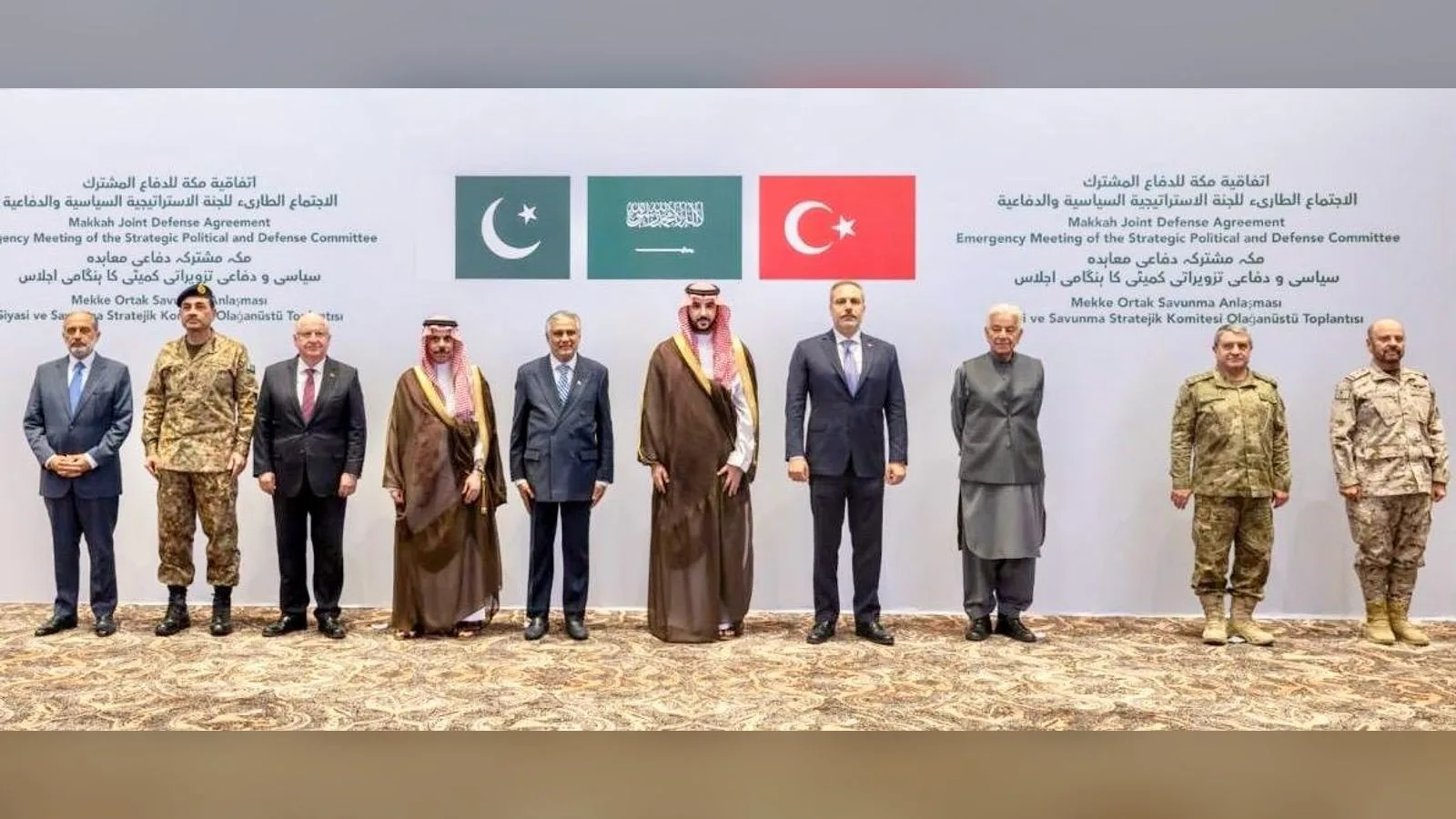 Foreign ministers, defence ministers and army chiefs of Pakistan, Saudi Arabia and Turkey stand together in Riyadh