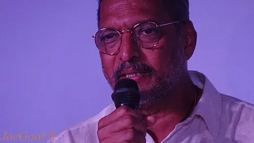 Nana Patekar speaks into a microphone at an event
