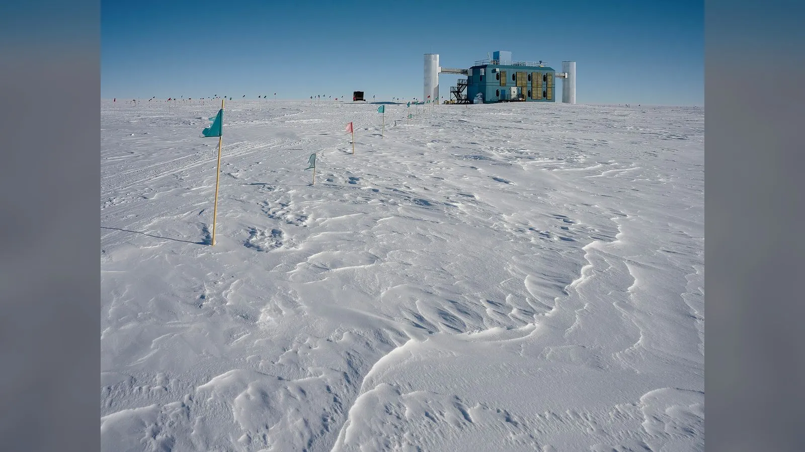 The IceCube Neutrino Observatory building on the snow at the South Pole