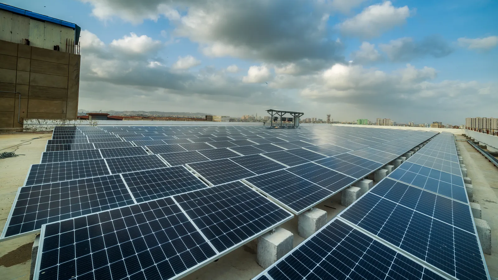 Rows of solar panels on a factory rooftop in Karachi's SITE industrial area