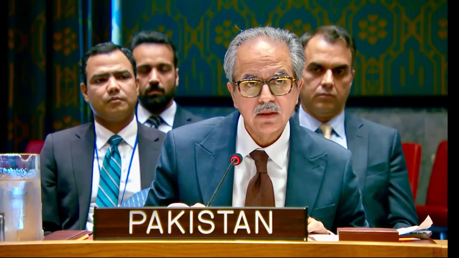 Ambassador Asim Iftikhar Ahmad speaks behind a Pakistan nameplate at the UN Security Council