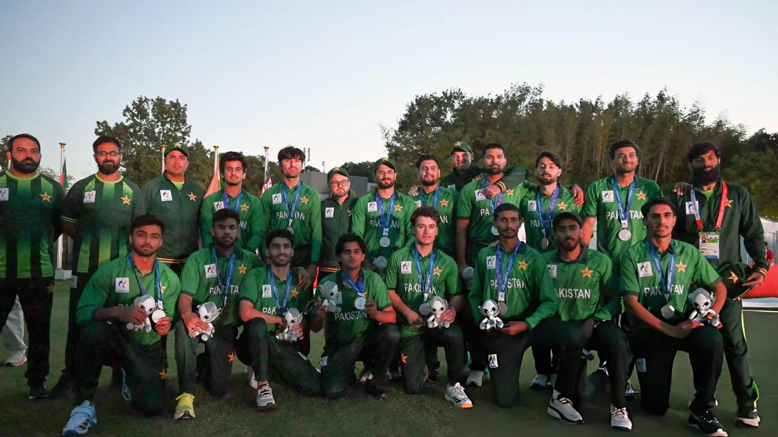 Pakistan's Asian Games cricket squad, captained by Sahibzada Farhan, posing with their silver medals