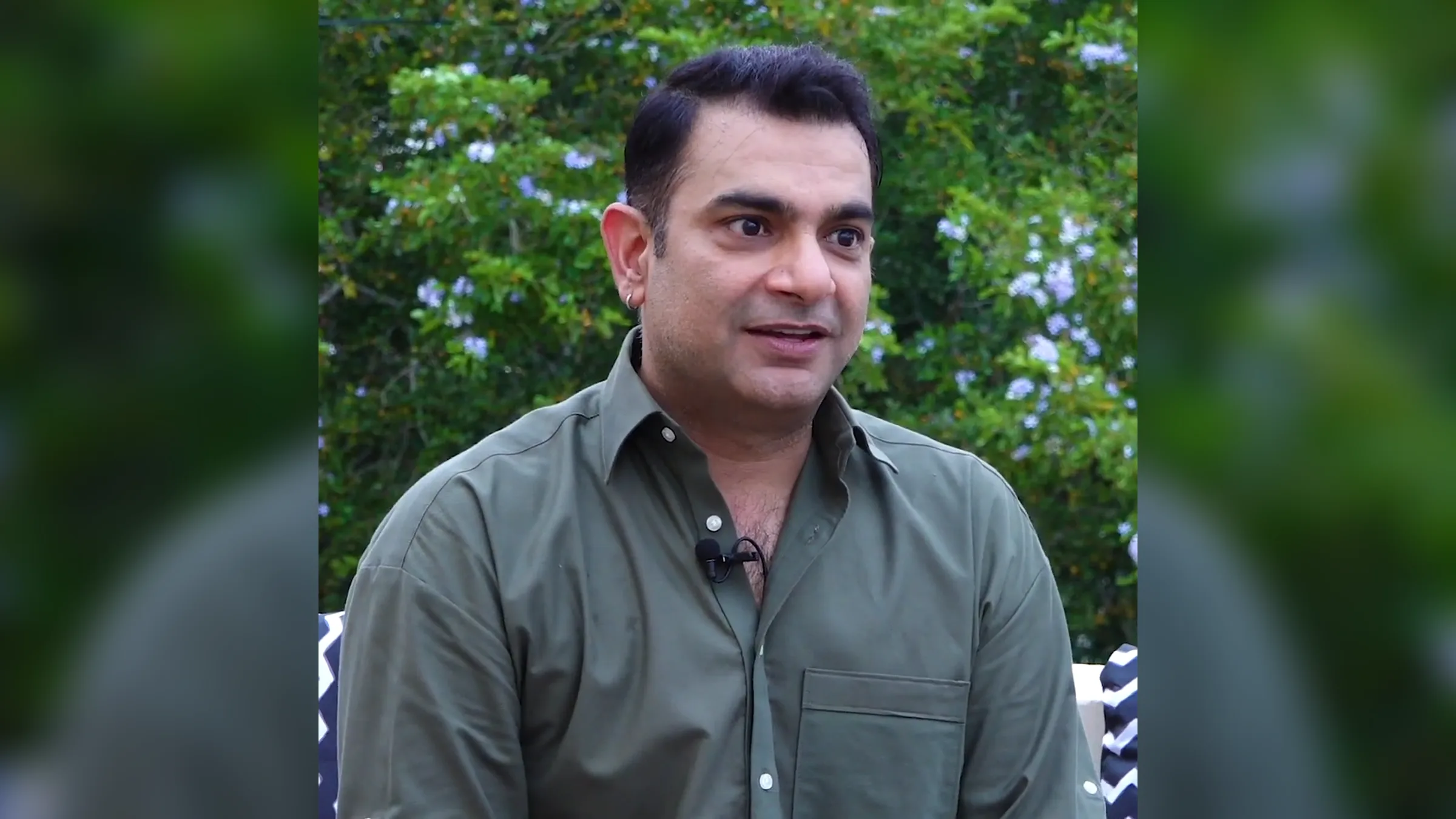 Director Sarmad Khoosat speaking in an interview outdoors
