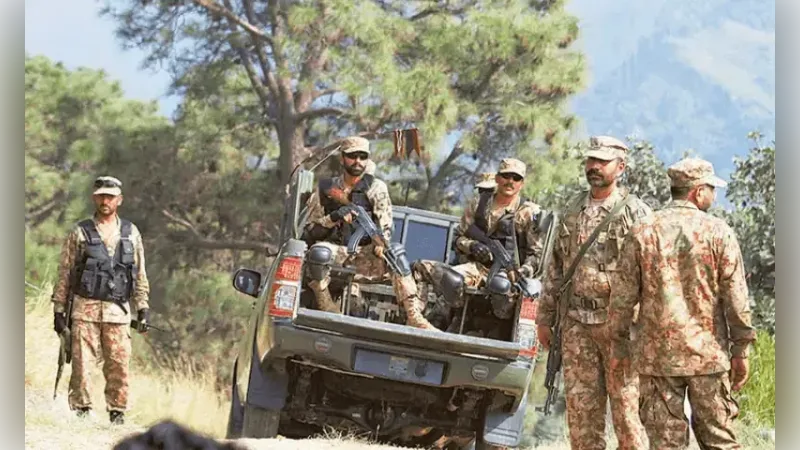 Pakistani soldiers step off a pickup truck carrying the national flag during an operation in Mastung