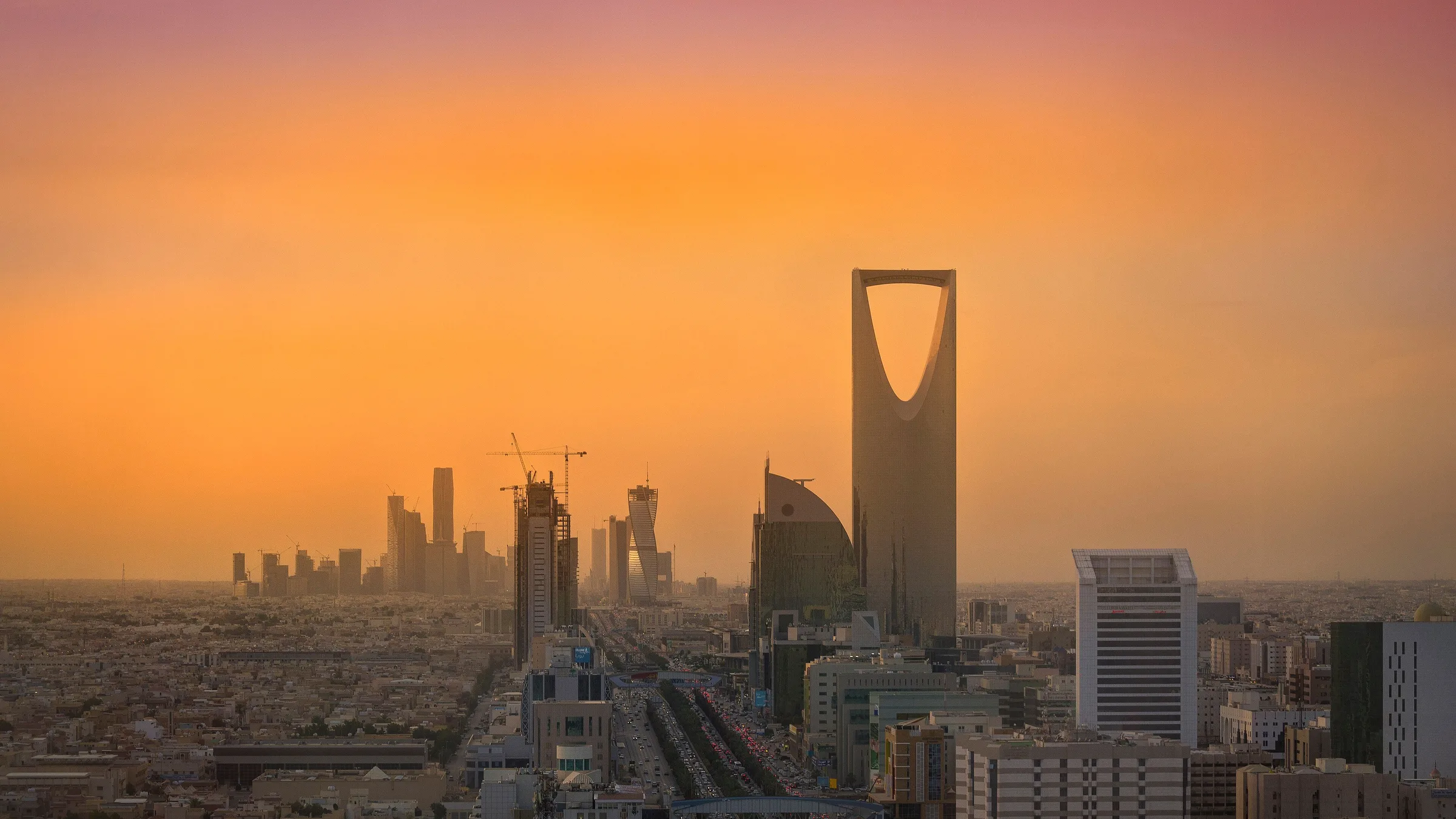 The Riyadh skyline at sunset with the Kingdom Centre tower
